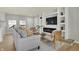 Living Room with gray sofa and built in shelving and fireplace at 8810 Beechwood Ave, Indianapolis, IN 46219