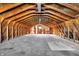 Large unfinished attic space with high ceilings and potential for future expansion at 8810 Beechwood Ave, Indianapolis, IN 46219