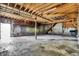 Large workshop with high ceilings, storage shelves, and concrete floor at 8810 Beechwood Ave, Indianapolis, IN 46219