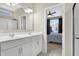 Double vanity bathroom with a large mirror and a shower at 1128 Sorrell Pass, Greenwood, IN 46143