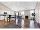 Open concept living room, kitchen and dining area with hardwood floors and fireplace at 1128 Sorrell Pass, Greenwood, IN 46143