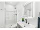 Modern bathroom with gray vanity and shower at 1219 E 15Th St, Indianapolis, IN 46202