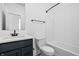 Clean bathroom, featuring a single vanity, bathtub, and subway tile at 1302 English Ave, Indianapolis, IN 46203