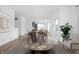 Open dining area with modern table and chairs, adjacent to living room at 1302 English Ave, Indianapolis, IN 46203