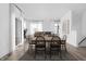 Bright dining room with modern table and chairs near large windows at 1302 English Ave, Indianapolis, IN 46203