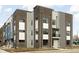 Modern three-story townhome with brick and siding exterior at 1302 English Ave, Indianapolis, IN 46203