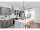 Modern kitchen island with white quartz countertop and wooden stools at 1302 English Ave, Indianapolis, IN 46203