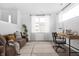 Home office with a wooden desk, comfortable sofa and large window at 1302 English Ave, Indianapolis, IN 46203