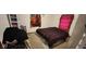 Spacious bedroom with dark-colored bedding and carpeted floor at 1313 S Riley Ave, Indianapolis, IN 46203