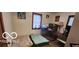 Smaller bedroom with two twin beds and colorful wall art at 1313 S Riley Ave, Indianapolis, IN 46203