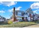 Charming brick townhome featuring a cozy porch and well-maintained lawn with snow at 1331 Ashville Dr, Westfield, IN 46074