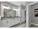 Modern bathroom with a double vanity and dark countertop at 19381 Sumrall Pl, Westfield, IN 46074