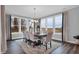 Bright dining room with large windows, hardwood floors, and a spacious table at 19381 Sumrall Pl, Westfield, IN 46074