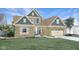 Two-story craftsman style home with neutral siding and landscaping at 19381 Sumrall Pl, Westfield, IN 46074