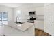 Modern kitchen with white cabinets, stainless steel appliances, and an island at 2046 Foothill Dr, Greenfield, IN 46140