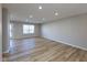 Spacious living room with light gray walls and wood-look floors at 2233 Historic Oaks Blvd, Indianapolis, IN 46214