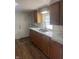 Efficient kitchen with wood cabinets and dual sink at 2401 W 27Th St, Anderson, IN 46016