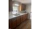 Simple kitchen with wood cabinets and laminate countertops at 2401 W 27Th St, Anderson, IN 46016