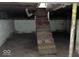 Unfinished basement with exposed support beams and concrete floor at 2729 Columbia Ave, Indianapolis, IN 46205