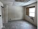 A stripped bedroom ready for renovation, with hardwood floors and a window at 2729 Columbia Ave, Indianapolis, IN 46205