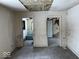 Unfinished bedroom with access to a bathroom and another room at 2729 Columbia Ave, Indianapolis, IN 46205