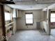 A kitchen undergoing a complete renovation, showing exposed walls, floors, and ceilings at 2729 Columbia Ave, Indianapolis, IN 46205