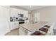 Kitchen island with granite countertop and seating for three at 3164 W Keepsake Ln, Monrovia, IN 46157