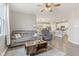 Living room features hardwood floors, a ceiling fan, and comfortable seating at 3164 W Keepsake Ln, Monrovia, IN 46157