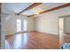 Living room with hardwood floors, exposed beams, and French doors at 345 E Hickory Ln, Indianapolis, IN 46227