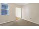 Well-lit bedroom with window, carpet, and access to another room at 3457 Heathcliff Ct, Westfield, IN 46074