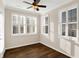 Sunroom with hardwood floors, plantation shutters and ceiling fan at 3457 Heathcliff Ct, Westfield, IN 46074