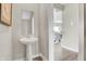 Small powder room with pedestal sink and modern fixtures at 3842 Sunset Ridge Dr, Franklin, IN 46131