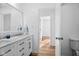 Clean bathroom, double vanity, marble countertop, and view of hallway at 407 E 9Th St, Sheridan, IN 46069