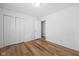 Well-lit bedroom with double doors leading to a closet and hardwood floors at 407 E 9Th St, Sheridan, IN 46069