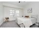 Cozy bedroom featuring a queen-size bed and ample natural light at 4724 E New York St, Indianapolis, IN 46201