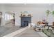 Modern dark gray brick fireplace in a bright living room at 4724 E New York St, Indianapolis, IN 46201