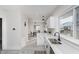 Clean kitchen design with white cabinets, quartz countertops, and stainless steel sink at 4724 E New York St, Indianapolis, IN 46201