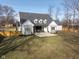 Spacious backyard with patio, and wooden fence at 5119 E 71St St, Indianapolis, IN 46220