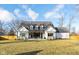 White two-story house with a large backyard at 5119 E 71St St, Indianapolis, IN 46220