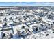 Aerial view of a snow-covered neighborhood with a frozen pond at 5632 Wild Horse Dr, Indianapolis, IN 46239