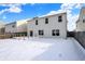 Snow covered backyard with deck and fence at 5632 Wild Horse Dr, Indianapolis, IN 46239