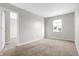 Spacious bedroom with neutral walls and carpeting at 5632 Wild Horse Dr, Indianapolis, IN 46239