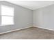 Bright bedroom with neutral walls and carpet at 5632 Wild Horse Dr, Indianapolis, IN 46239