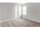 Simple bedroom with neutral walls, carpeting and a window at 5632 Wild Horse Dr, Indianapolis, IN 46239