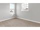 Well-lit bedroom featuring neutral walls and two windows at 5632 Wild Horse Dr, Indianapolis, IN 46239