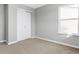 Bright bedroom with neutral walls, carpeting, and window at 5632 Wild Horse Dr, Indianapolis, IN 46239