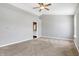 Primary bedroom with carpeting and access to bathroom at 5632 Wild Horse Dr, Indianapolis, IN 46239