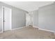Spacious bedroom with neutral walls and carpeting, and access to another room at 5632 Wild Horse Dr, Indianapolis, IN 46239