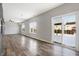Spacious dining room with hardwood floors and sliding glass doors leading to backyard at 5632 Wild Horse Dr, Indianapolis, IN 46239