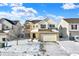 Two-story house with brick and siding, two-car garage, and snow-covered yard at 5632 Wild Horse Dr, Indianapolis, IN 46239